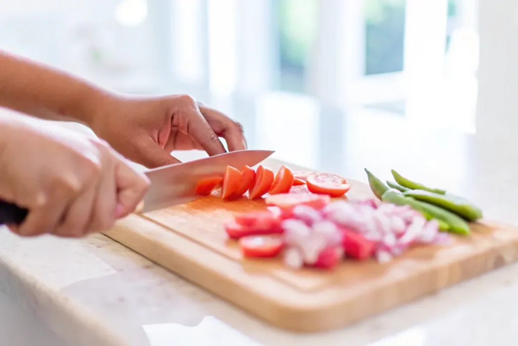 Fresh ingredients for Sinigang on a wooden table.
